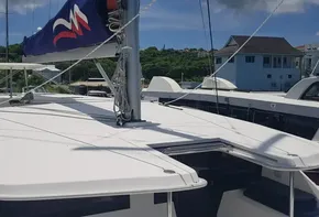 2017 Leopard 48 catamaran docked at marina under clear sky.
