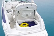 Crownline Cruiser 250 CR - Large aft storage compartment features a concealed holder for portable table and pedestal