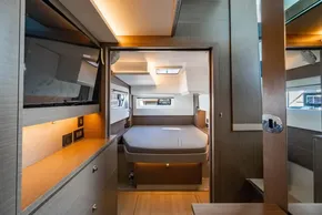 Luxurious interior of 2025 Leopard 46 yacht with modern bedroom and sleek design.