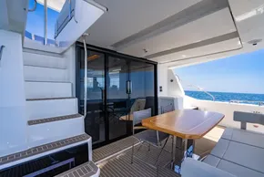 2025 Leopard 40 Powercat yacht deck with seating, table, and ocean view.