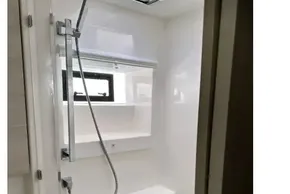 Modern shower area in 2021 Leopard 50 yacht with sleek fixtures and natural light.