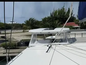 Leopard 50 catamaran, 2020 model, docked with lush greenery in the background.