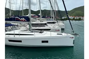 2023 Beneteau Oceanis 51.1 sailboats docked in a scenic marina setting.