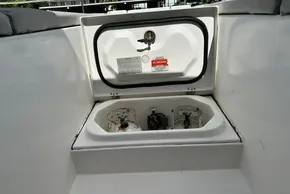 Leopard 53 Powercat 2022 boat compartment with safety labels and equipment.