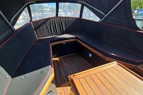 Interior of 2008 Menken Maritiem The Cab motor yacht with wooden flooring and cushioned seating.