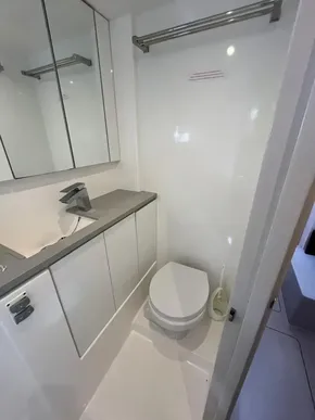 Modern bathroom in 2019 Leopard 45 yacht with sleek fixtures and ample storage.
