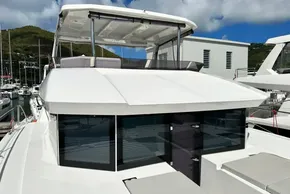 2025 Robertson and Caine Leopard 46 Powercat docked at marina, showcasing sleek design.