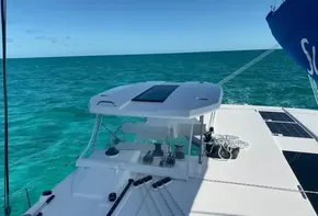 Leopard 45 catamaran sailing on clear turquoise waters, 2020 model.