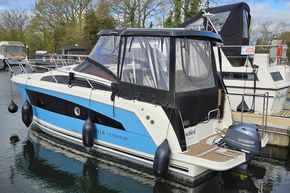 2023 Balt 818 Titanium boat docked, featuring a Yamaha motor and protective canopy.