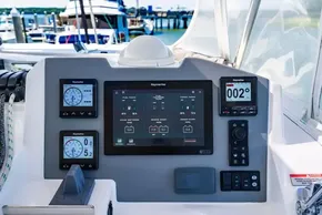 Leopard 50 yacht control panel with Raymarine displays, 2022 model, docked at marina.