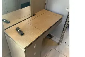 Modern wooden vanity with mirror and remote control in Leopard 46, 2025 model yacht.