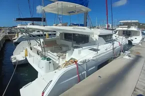 2020 Lagoon 46 catamaran docked at marina, featuring spacious deck and modern design.