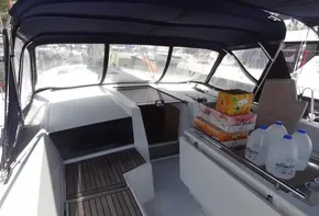 Beneteau Oceanis 46.1 2020 sailboat cockpit with provisions and covered seating area.