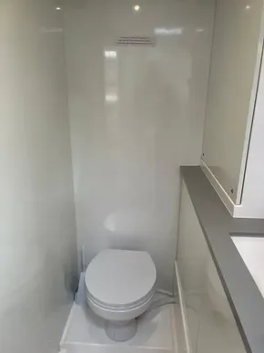 Modern bathroom in 2019 Leopard 45 yacht with sleek white design.