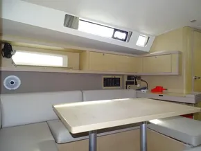 Interior of 2017 Beneteau Oceanis 45 yacht with modern seating and table.