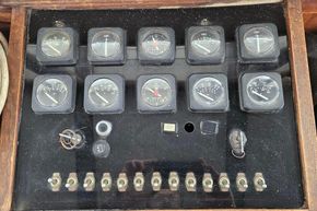 Control panel of a 1926 Dutch Barge Luxemotor with gauges and switches.