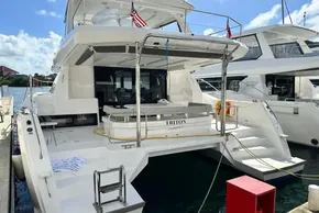 2025 Robertson and Caine Leopard 46 Powercat docked, featuring spacious deck and modern design.