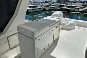 2022 Leopard 53 Powercat yacht deck with storage unit and marina view.