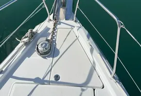 Bow of 2020 Beneteau Oceanis 46.1 sailboat on calm water.