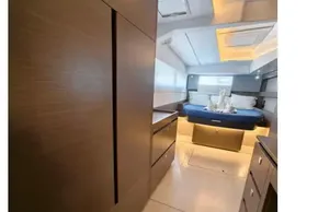Luxurious interior of 2021 Leopard 50 yacht with modern wood finishes and ambient lighting.