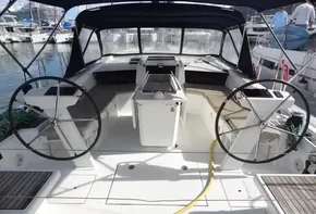 Beneteau Oceanis 46.1 2020 sailboat cockpit with dual steering wheels at marina.