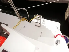 Leopard 40 catamaran deck with ladder and ropes, docked at marina, 2021 model.