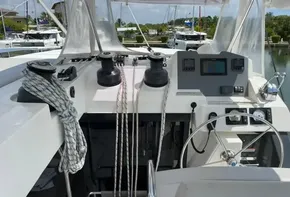Leopard 50 yacht cockpit with navigation equipment and ropes, docked in a marina, 2020 model.