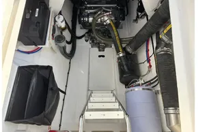 Engine compartment of 2024 Leopard 40 Powercat, showcasing mechanical components and storage.