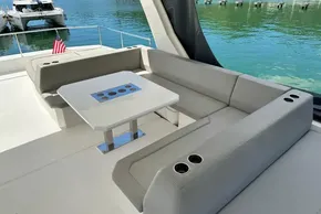Luxurious seating area on 2022 Leopard 53 Powercat yacht with waterfront view.