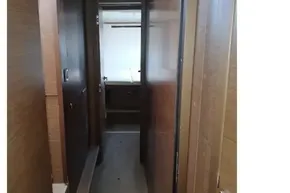 Interior hallway of 2020 Lagoon 46 yacht with wooden paneling.