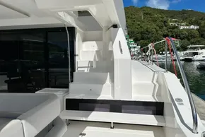 2022 Leopard 53 Powercat yacht docked, featuring sleek white design and modern amenities.