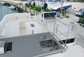 Leopard 43 Powercat 2022 yacht deck with sink and seating area.