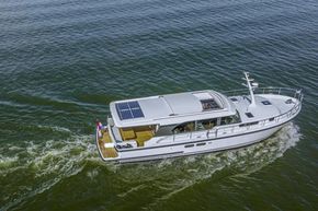 2025 Linssen 45 SL Sedan yacht cruising on open water, featuring solar panels.