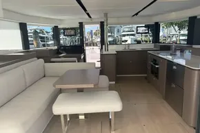 Luxurious interior of 2025 Leopard 46 yacht with modern kitchen and seating area.