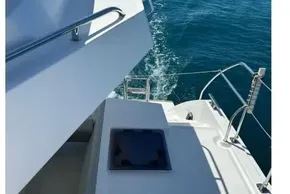 Leopard 42 yacht deck view, 2022 model, cruising on clear blue ocean waters.