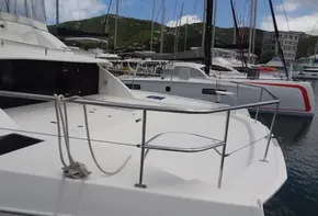 2020 Leopard 43 Powercat docked in a marina with other boats.