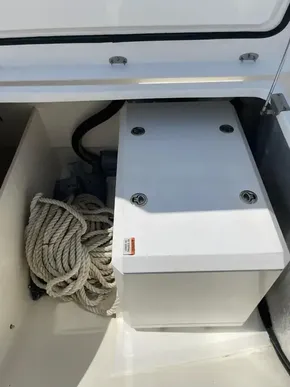 Storage compartment on a 2020 Leopard 50 boat with coiled rope.
