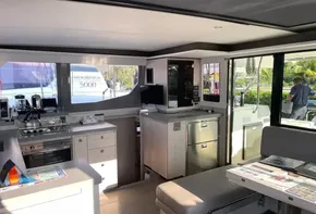 Modern interior of 2021 Leopard 45 yacht with kitchen and seating area.