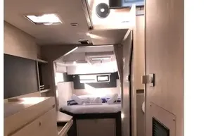 Modern interior of 2020 Leopard 40 catamaran with cozy bedroom and sleek design.
