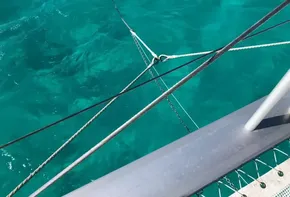 View from Leopard 45 catamaran over clear turquoise water, 2020 model.