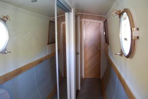 Corridor to bedroom with storage