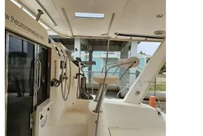 Interior view of a 2008 Leopard 40 catamaran, featuring seating and helm controls.