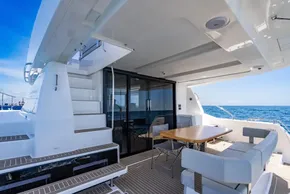 2025 Leopard 40 Powercat yacht deck with seating, table, and ocean view.