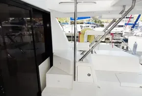2018 Leopard 43 Powercat yacht interior with stairs and marina view.