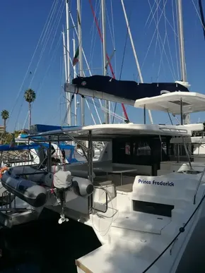 2019 Leopard 45 catamaran docked, featuring spacious deck and modern design.