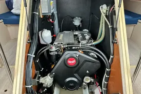 Engine compartment of 2023 Beneteau Oceanis 51.1 sailboat, showcasing mechanical components.
