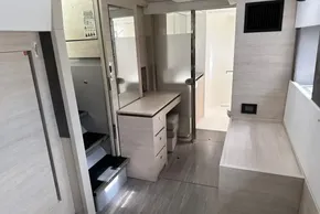 Modern interior of 2021 Leopard 50 yacht with sleek wood finishes and compact design.