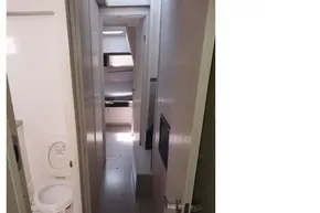 Interior of 2018 Leopard 45 yacht showing hallway and bathroom.