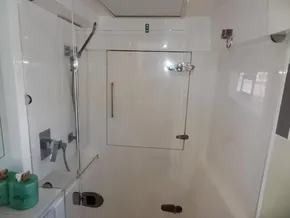 Modern bathroom in 2017 Leopard 43 Powercat yacht with glass shower enclosure.