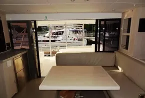 Interior of 2017 Leopard 43 Powercat with marina view through sliding doors.